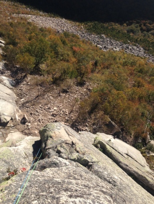 Sport climber on crack. Fresh rock fall DZ on the left
